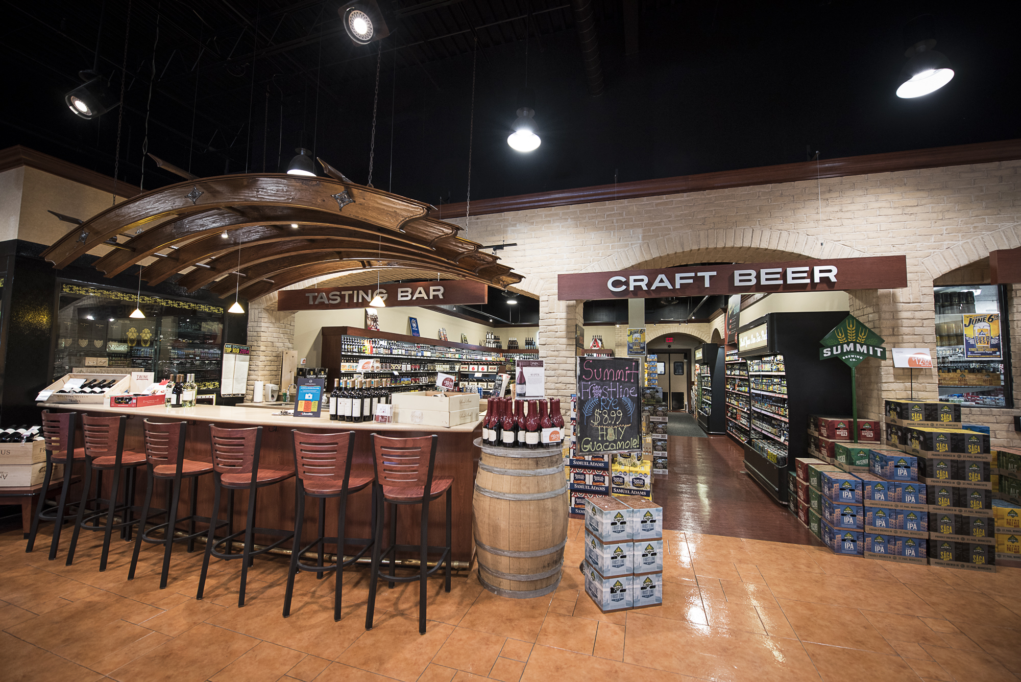 A tasting bar next to a craft beer section.