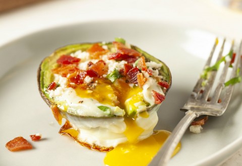 Egg in an Avocado with Bacon and Cotija Cheese