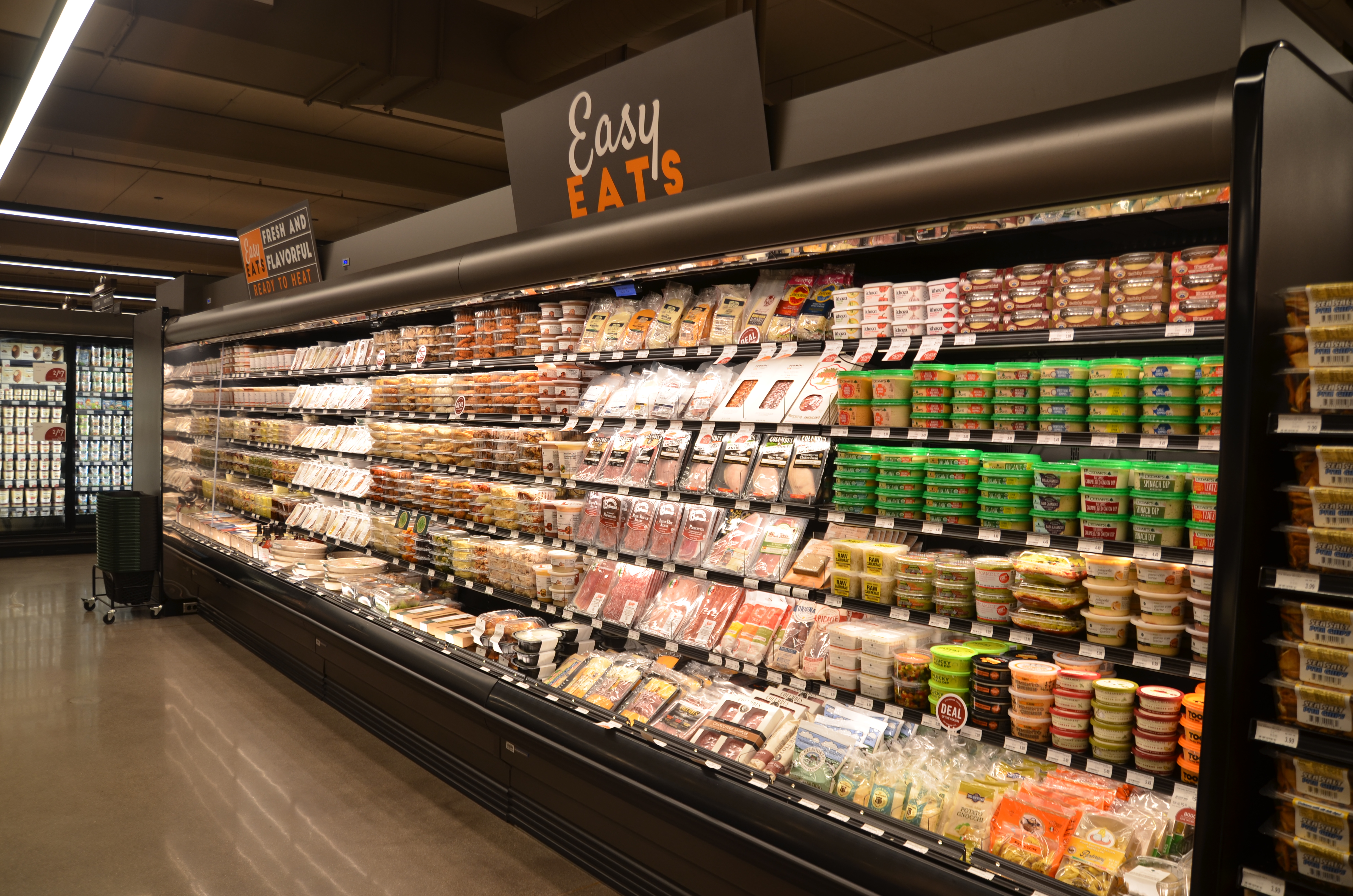 An easy eats section with hummus, pre-portioned food, and packaged meats.